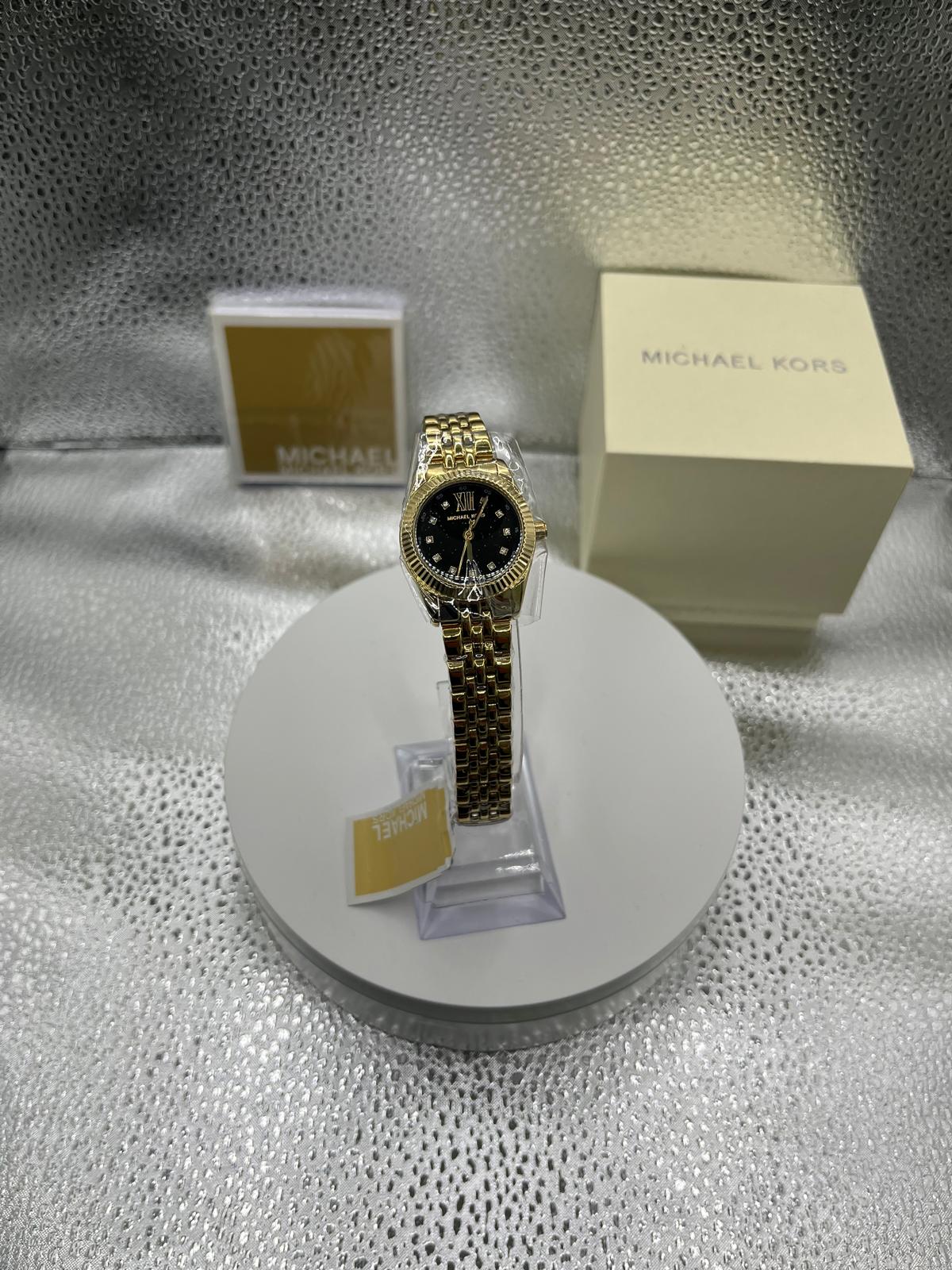 Michael Kors Lexington avec cadran bleu et bracelet en acier doré pour femme MK4802